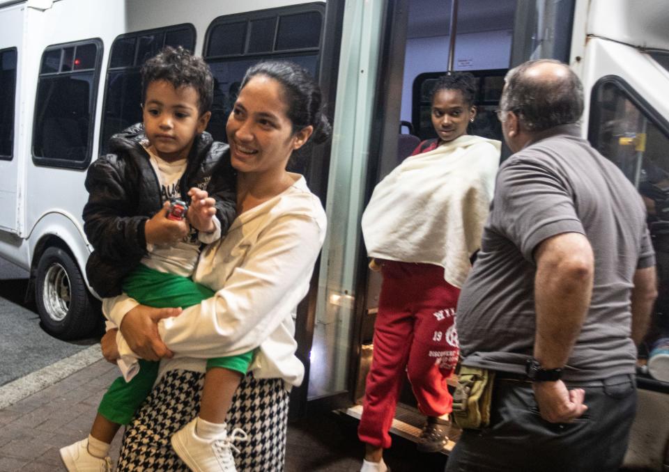 Families of asylum seekers are led into the Ramada hotel in Yonkers May 15, 2023. The families were being housed in New York City.