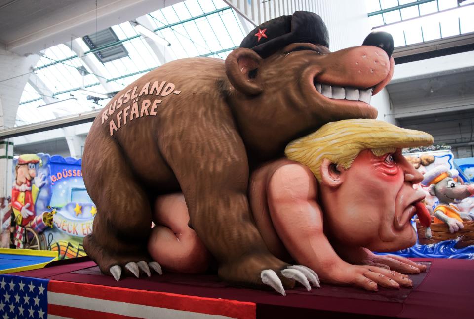 <p>A carnival float, depicting a bear with the writing “Russia affair” on US President Donald Trump, is being prepared at a warehouse ahead of a carnival parade on Rose Monday on Feb. 12, 2018 in Duesseldorf, southern Germany. (Photo: Marcel Kusch/Getty Images) </p>