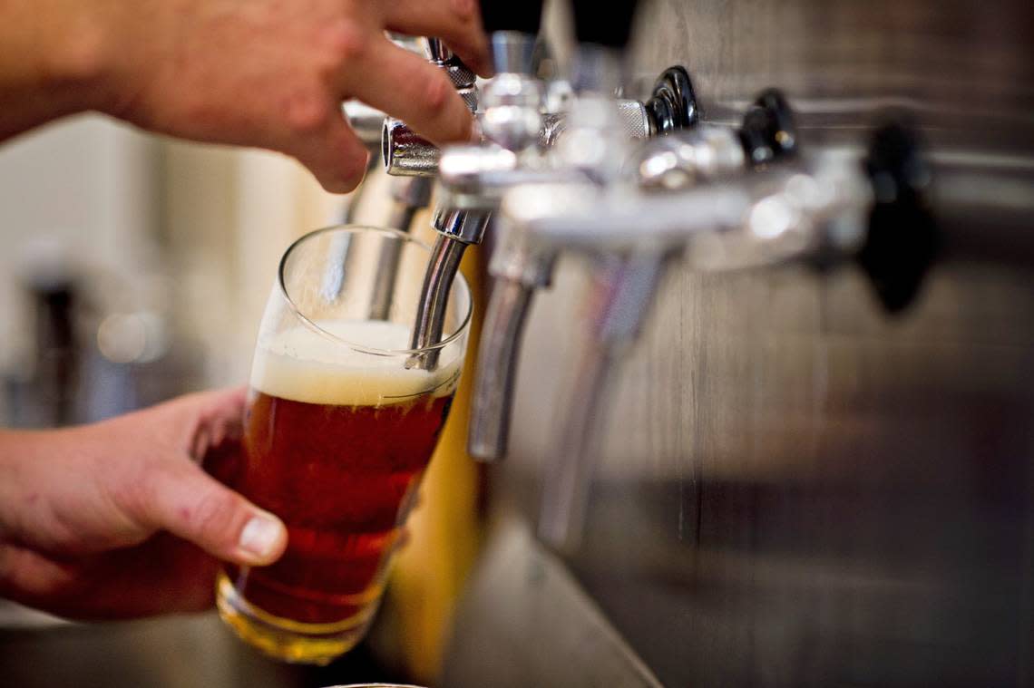 Beer flows from one of the taps at award-winning Sudwerk Brewing Company during a beer tasting at the venerable Davis brewery. It’s among the local eateries featured in new Food Network show “Best Bite in Town.”