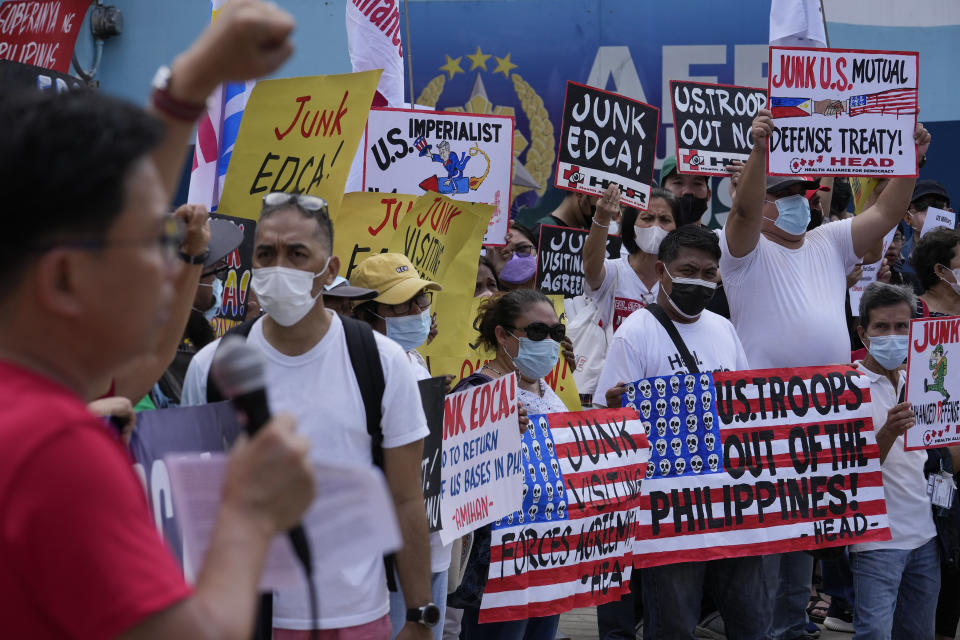 Demonstrators hold slogans as they protest against the visit of U.S. Defense Secretary Lloyd Austin outside Camp Aguinaldo military headquarters in metro Manila, Philippines on Thursday, Feb. 2, 2023. Austin is in the Philippines for talks about deploying U.S. forces and weapons in more Philippine military camps to ramp up deterrence against China's increasingly aggressive actions toward Taiwan and in the disputed South China Sea. (AP Photo/Aaron Favila)