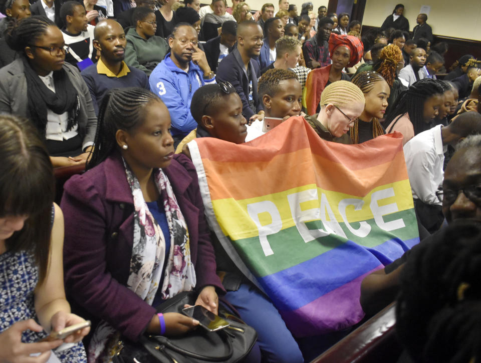 Activists sit in a courtroom to wait the decision by the High Court in Gaborone, Botswana, Tuesday June 11, 2019. Botswana became the latest country to decriminalize gay sex when the High Court rejected as unconstitutional sections of the penal code that punish same-sex relations with up to seven years in prison. (AP Photo)