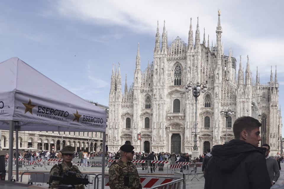 Soldiers patrol in front of Milan gothic cathedral in Milan, Monday, March 25, 2024. Italy followed France Monday in stepping up its security stance following the attack on a suburban Moscow concert hall and the claim of responsibility by an affiliate of the Islamic State group. (AP Photo/Luca Bruno)