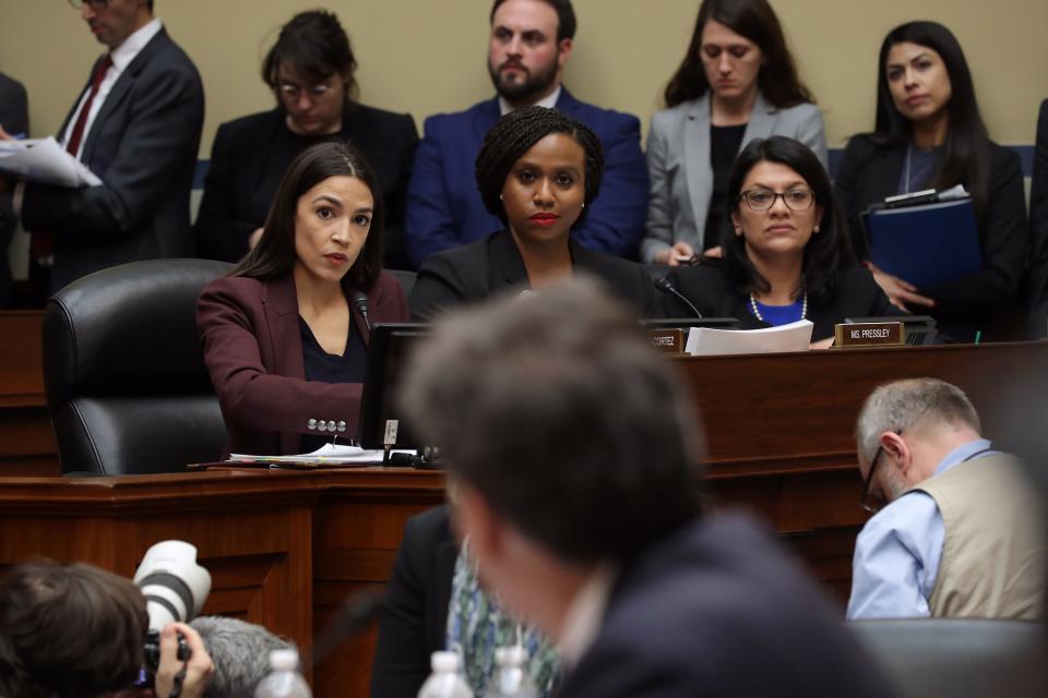 Rep. Alexandria Ocasio-Cortez , D-N.Y., Rep. Ayanna Pressley, D-Mass., and Rep. Rashida Tlaib, D-Mich., listen as Michael Cohen, former attorney and fixer for President Donald Trump, testifies before the House Oversight Committee on Capitol Hill Feb. 27, 2019 in Washington.