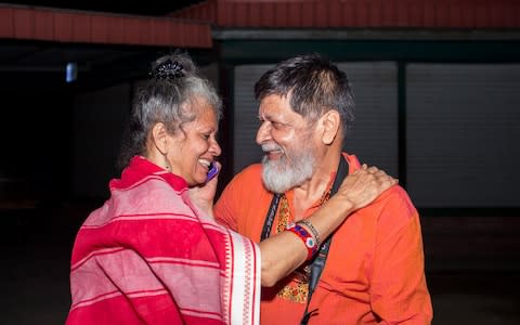 Shahidul Alam celebrates with his wife Rahnuma Ahmad following is release from jail - Credit:  SUMAN PAUL/AFP