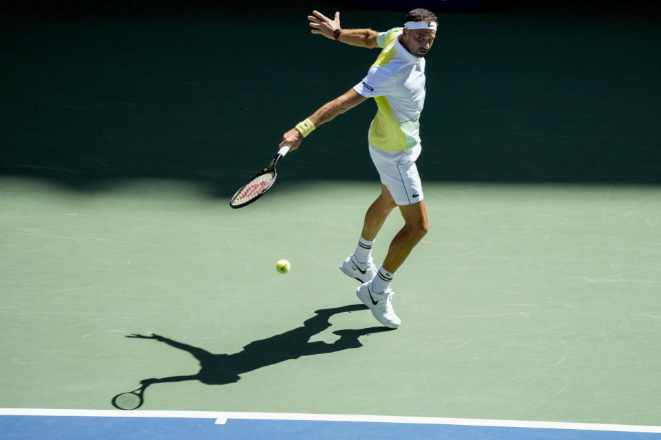 Grigor Dimitrov, of Bulgaria, returns a shot to Andy Murray, of Great Britain, during the second round of the U.S. Open tennis championships, Thursday, Aug. 31, 2023, in New York. (AP Photo/Mary Altaffer)