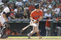 Houston Astros' Kyle Tucker watches his two-run home run, next to Seattle Mariners catcher Tom Murphy, during the eighth inning of a baseball game Wednesday, July 28, 2021, in Seattle. (AP Photo/Jason Redmond)