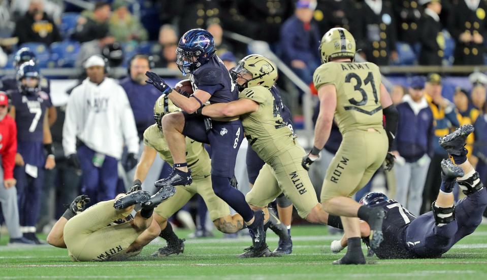 Navy fullback Alex Tecza (46) carries the ball during the second half of the Army-Navy Game at Gillette Stadium.