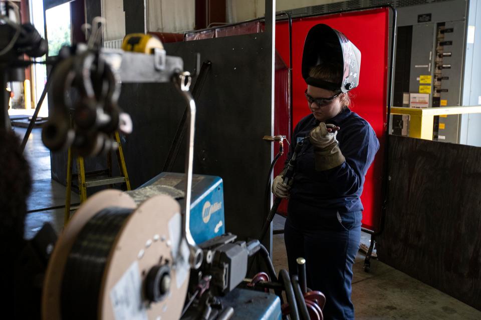 Magdalene Fett, 17, prepares the welding torch on Aug. 22, 2022, at Renco Machine Inc., in Green Bay, Wis. Fett is a part of the Wisconsin Apprenticeship Program.