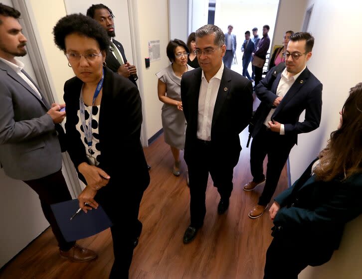 Long Beach, CA - United States Secretary of Health and Human Services Xavier Becerra, center, tours the Long Beach Public Health Department and hosts a roundtable on pandemic preparedness with local public health officials. June 01: in Long Beach on Thursday, June 1, 2023 in Long Beach, CA. (Luis Sinco / Los Angeles Times)