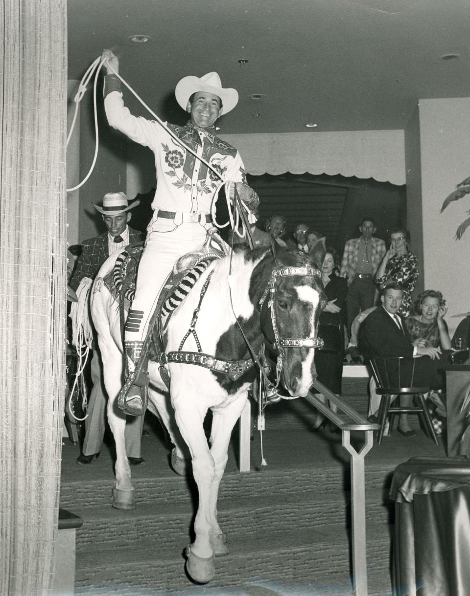 Montie Montana rides his horse into the El Mirador Hotel in Palm Springs.