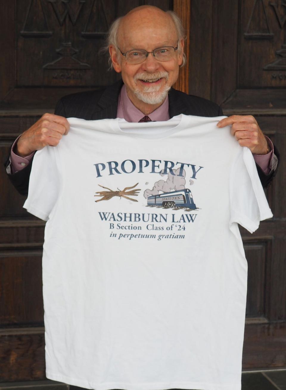 Students in Myrl Duncan's final property law class presented him with several keepsakes in December 2021.