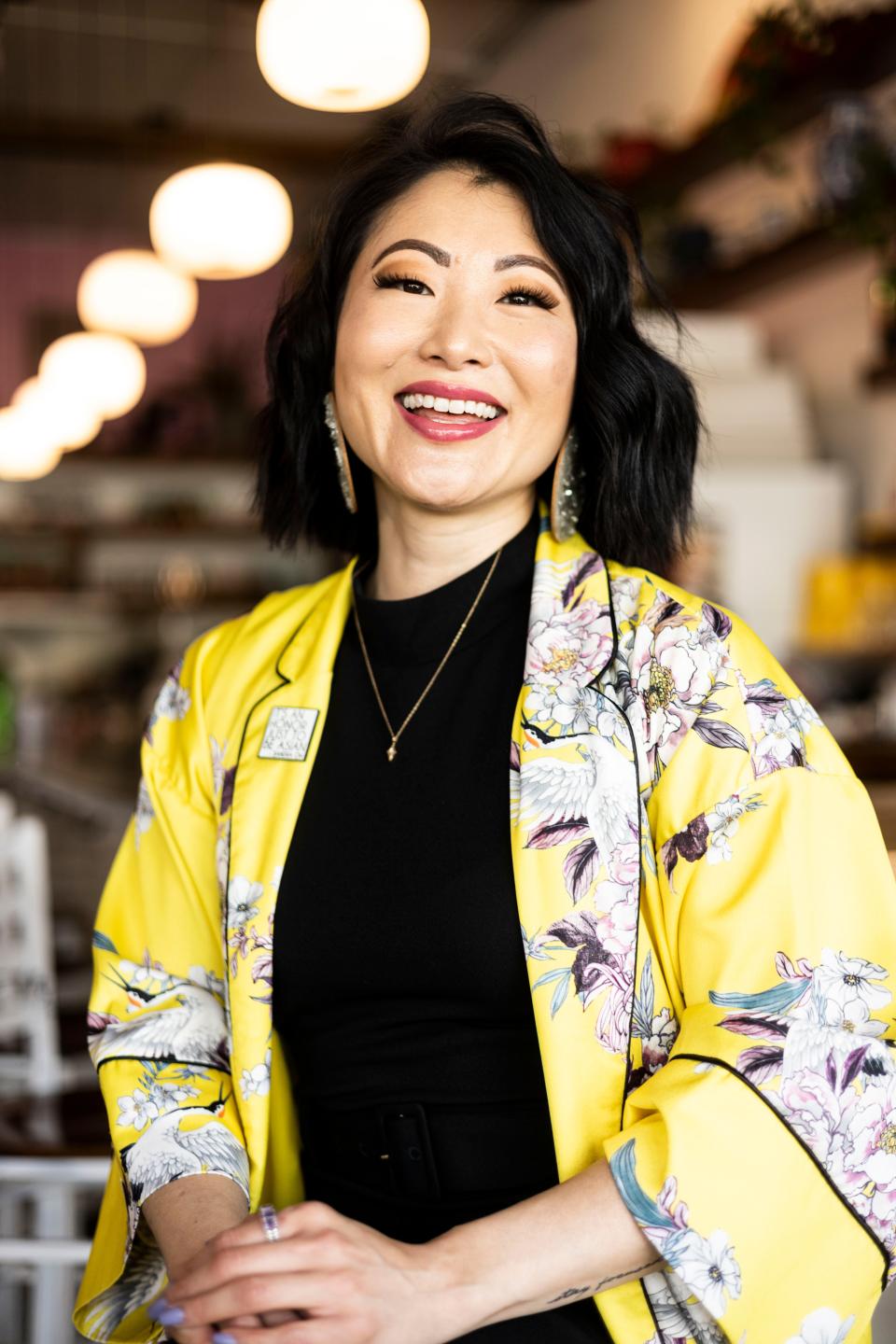 SunAh Laybourn is a University of Memphis sociology professor who led the charge to have Memphis-based programming during Asian American and Pacific Islander Heritage Month in Memphis for the first time this year. She poses for a portrait on May 24, 2023, at the bar inside of Good Fortune in Downtown Memphis.
