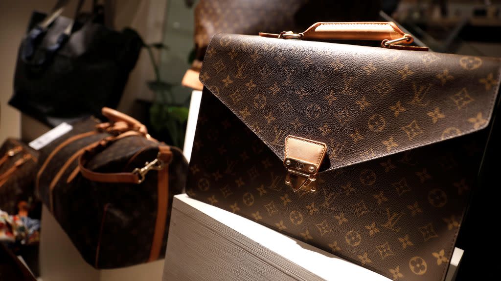 Louis Vuitton bags for sale are displayed at The RealReal shop