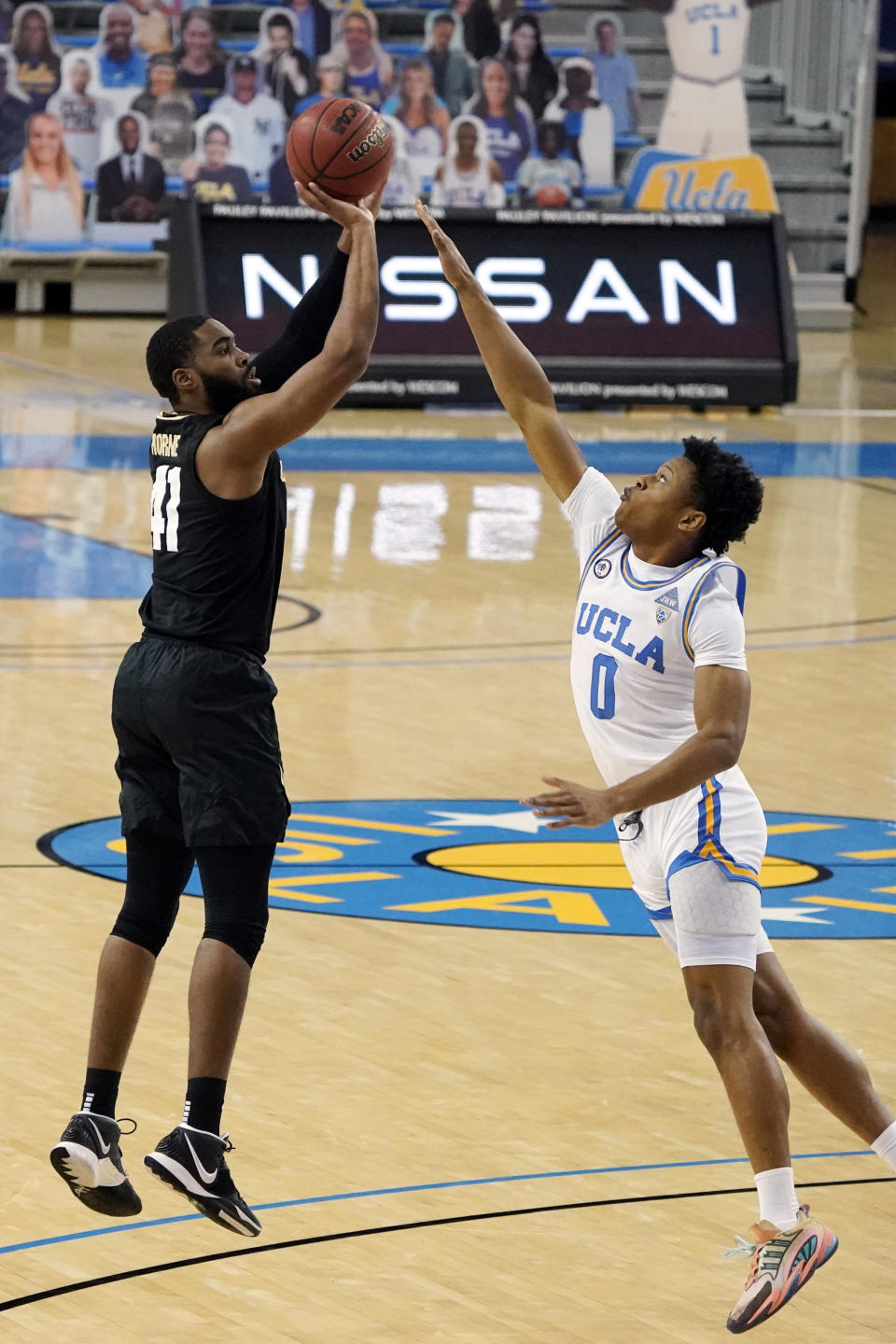 Colorado forward Jeriah Horne (41) shoots over UCLA guard Jaylen Clark (0) during the first half of an NCAA college basketball game Saturday, Jan. 2, 2021, in Los Angeles. (AP Photo/Marcio Jose Sanchez)