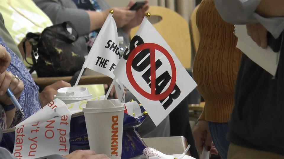 Residents wait to speak out against the proposed Green Development solar project in Johnston.