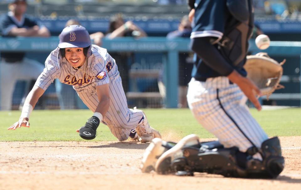 Bell's Jayden Barrientos scores the game's first run in the sixth inning of the City Section Open Division championship game.