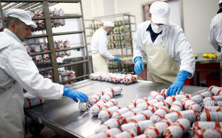 Workers work in salami production section in Akova Impex Meat Industry Ovako, which makes halal quality certified products, in Sarajevo, Bosnia and Herzegovina, December 2, 2016. REUTERS/Dado Ruvic