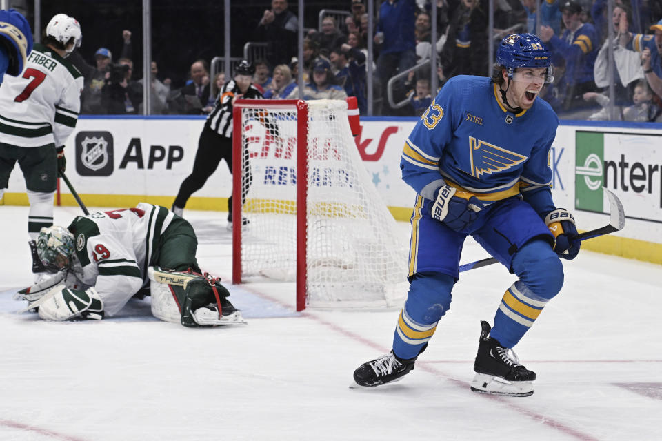 St. Louis Blues' Jake Neighbours (63) celebrates scoring a goal against the Minnesota Wild during second period of an NHL hockey game Saturday, March 2, 2024, in St. Louis. (AP Photo/Michael Thomas)