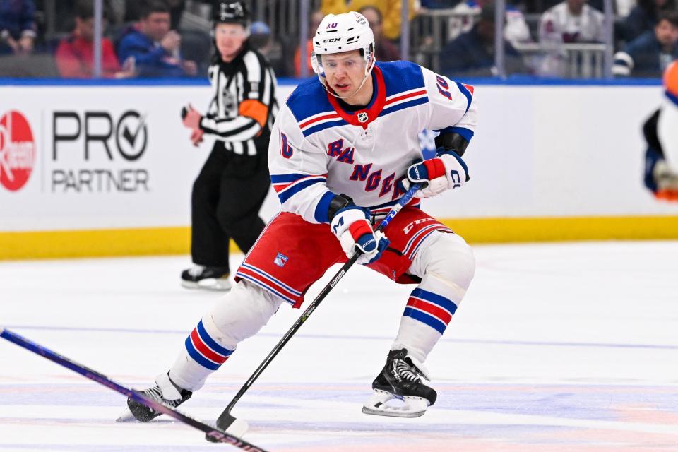 Apr 9, 2024; Elmont, New York, USA; New York Rangers left wing Artemi Panarin (10) skates across center ice against the New York Islanders during the third period at UBS Arena.