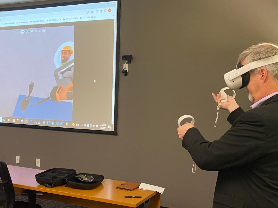 Keith Fletcher demonstrates a virtual reality manufacturing class that Goodwill clients will be able to take with a new partnership.