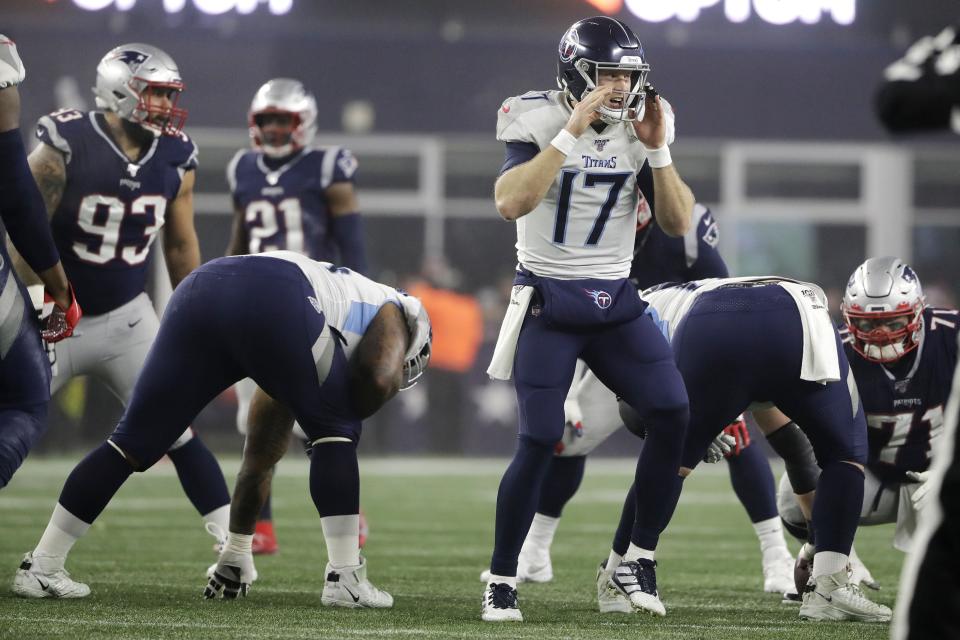 Tennessee Titans quarterback Ryan Tannehill calls signals at the line of scrimmage in the second half of an NFL wild-card playoff football game against the New England Patriots, Saturday, Jan. 4, 2020, in Foxborough, Mass. (AP Photo/Steven Senne)