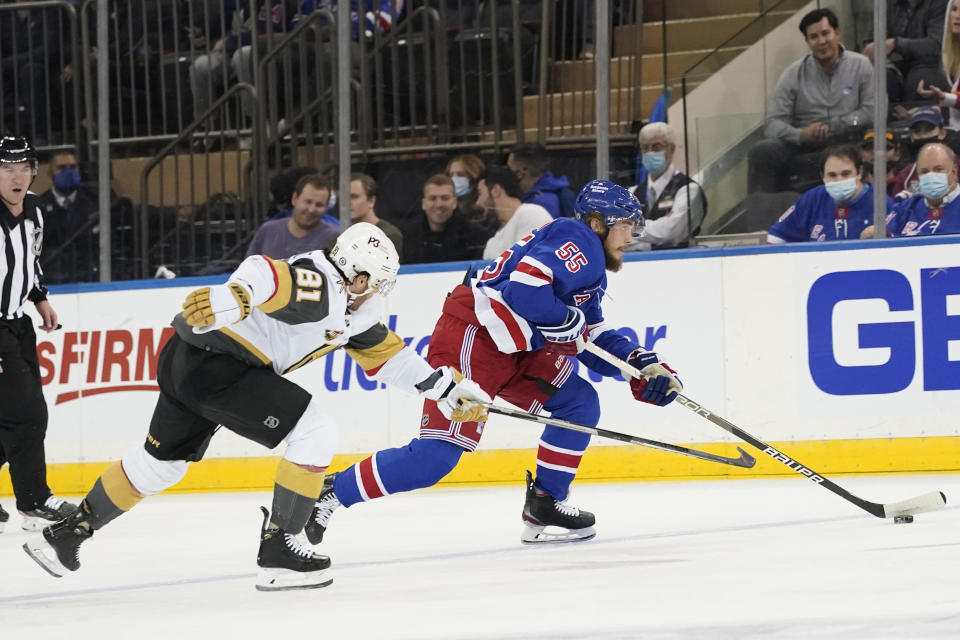 New York Rangers defenseman Ryan Lindgren (55) skates against Vegas Golden Knights center Jonathan Marchessault (81) during the first period of an NHL hockey game, Friday, Dec. 17, 2021, at Madison Square Garden in New York. (AP Photo/Mary Altaffer)