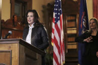 FILE - In an Oct. 8, 2020 file photo provided by the Michigan Office of the Governor, Michigan Gov. Gretchen Whitmer addresses the state during a speech in Lansing, Mich. The governor delivered remarks addressing Michiganders after the Michigan Attorney General, Michigan State Police, U.S. Department of Justice, and FBI announced state and federal charges against 13 members of two militia groups who were preparing to kidnap and possibly kill the governor. (Michigan Office of the Governor via AP File)