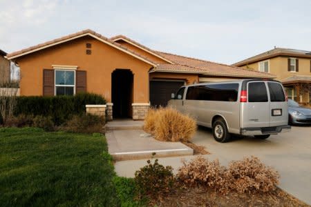 A van sits parked on the driveway of the home of David Allen Turpin and Louise Ann Turpin in Perris, California, U.S.  January 15, 2018.   REUTERS/Mike Blake