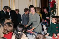 <p>Grace Kelly tends to her royal duties and distributes toys at the palace, along with her children Stephanie and Albert.</p>