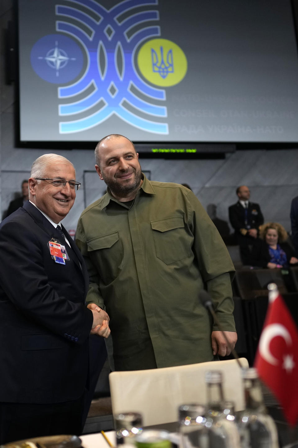 Ukraine's Defense Minister Rustem Umerov, right, poses with Turkey's Defense Minister Yasar Guler during a meeting of the NATO-Ukraine council in defense ministers format at NATO headquarters in Brussels, Thursday, June 13, 2024. NATO defense ministers gathered Thursday hoping to agree on a new plan to provide long-term security assistance and military training to Ukraine, after Hungary promised not to veto the scheme as long as it's not forced to take part. (AP Photo/Virginia Mayo)