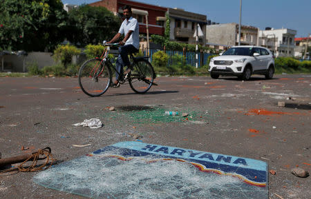 Debris are seen in the streets in Panchkula, India August 26, 2017. REUTERS/Cathal McNaughton