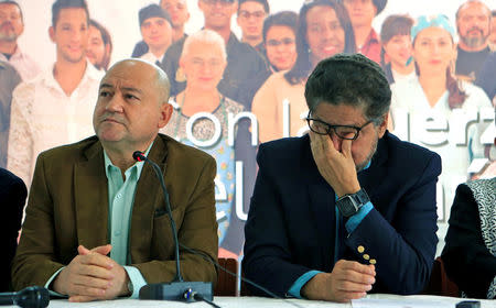 Ivan Marquez and Carlos Antonio Lozada of the political party of the FARC speak during a news conference in Bogota, Colombia March 8, 2018. REUTERS/Jaime Saldarriaga