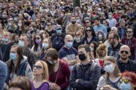 People attend a protest in front of the Serbian parliament in Belgrade