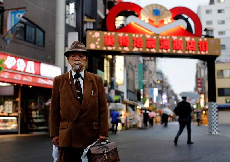 FILE PHOTO: The Wider Image: From the streets of Tokyo, 22 residents weigh up the Olympic Games