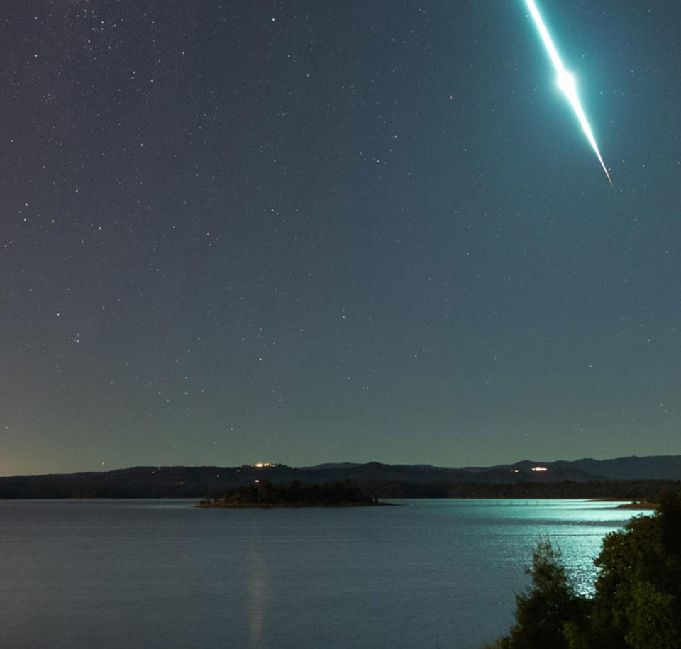 Photographer Craig Turton snapped a photo at North Pine Dam on Saturday night of a flashing light in the sky pictured here. It turns out it was a meteor likely due to the 'Taurid Swarm'. It's likely to be leftover debris from a large comet.