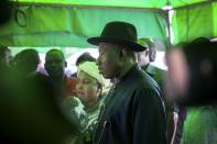Incumbent Nigerian president Goodluck Jonathan arrives to cast his ballot during presidential elections at a polling station in Otuoke on March 28, 2015