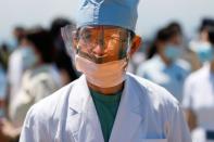 Japan Air Self-Defense Force stages a flyover to salute the medical workers at the frontline of the fight against the coronavirus disease (COVID-19), in Tokyo