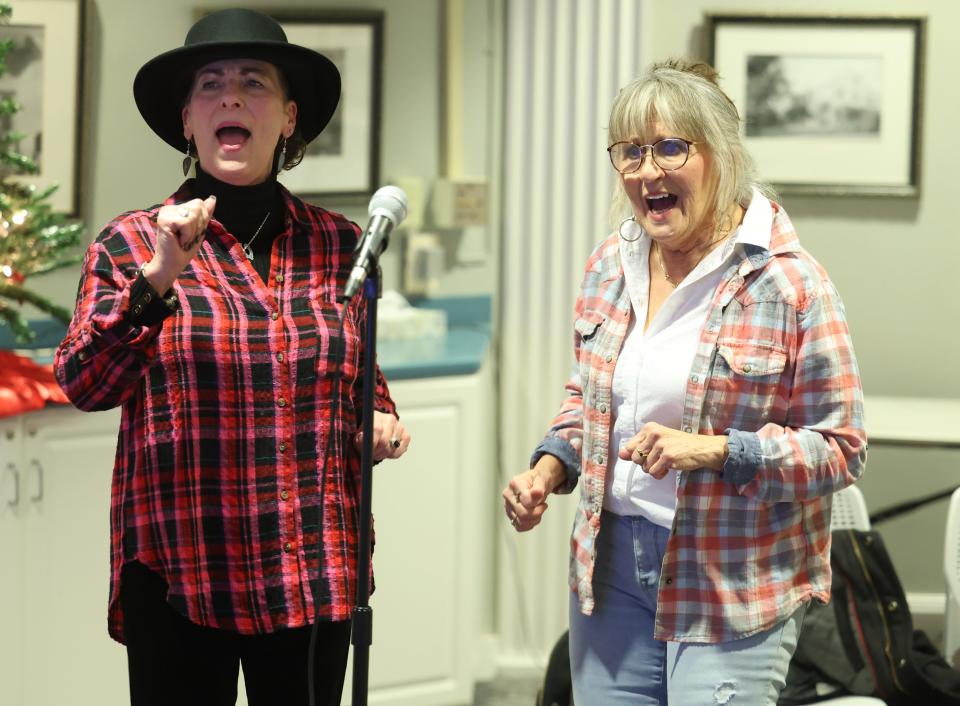 Mary Jane Corwin, left, and Paula Moore-Ramano sing Linda Ronstadt's "When Will I be Loved" on Monday, Dec. 4, 2023, at Jam Night at Massillon Public Library.