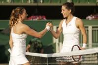 Andrea Petkovic of Germany shakes the hand of Mariana Duque-Marino after winning their match at the Wimbledon Tennis Championships in London, July 1, 2015. REUTERS/Henry Browne