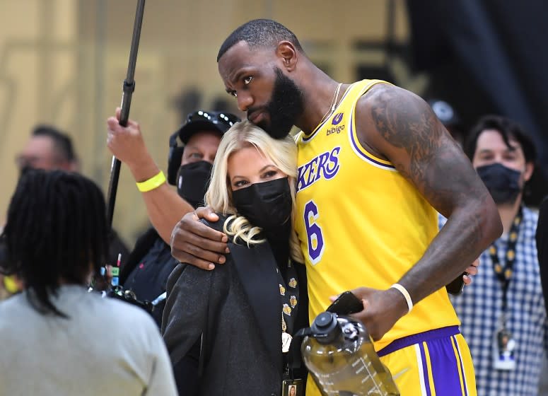 El Segundo, CA. September 28, 2021: Lakers LeBron James hugs owner Jeannie Buss during media day at the UCLA Health Training Center in El Segundo Tuesday. (Wally Skalij/Los Angeles Times)