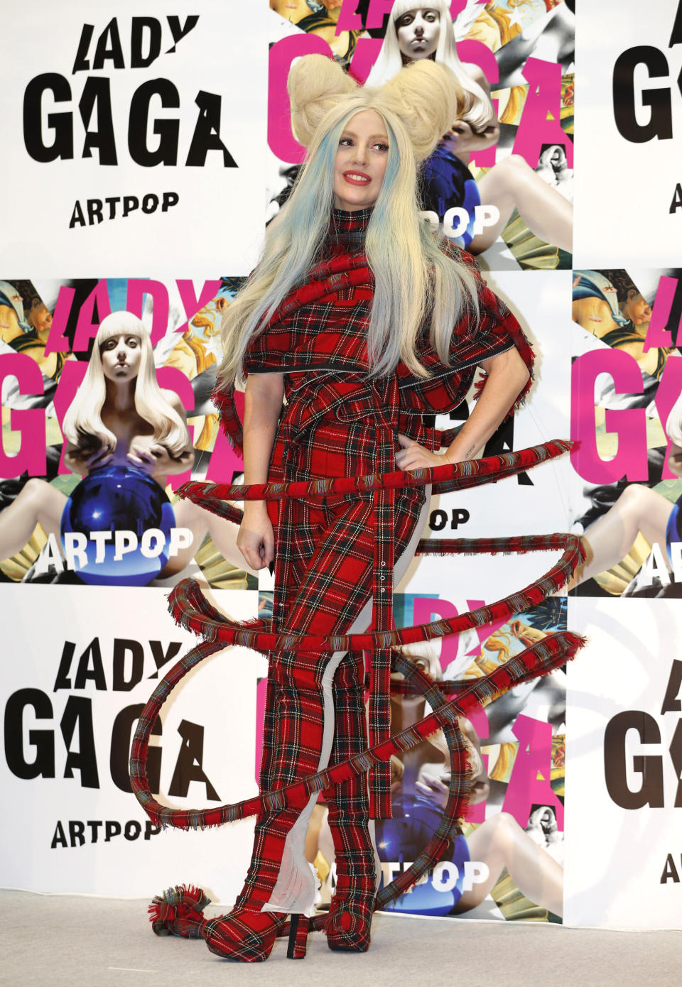 Lady Gaga poses for photographers during a press conference to promote her album "ARTPOP" in Tokyo, Sunday, Dec. 1, 2013. (AP Photo/Shizuo Kambayashi)