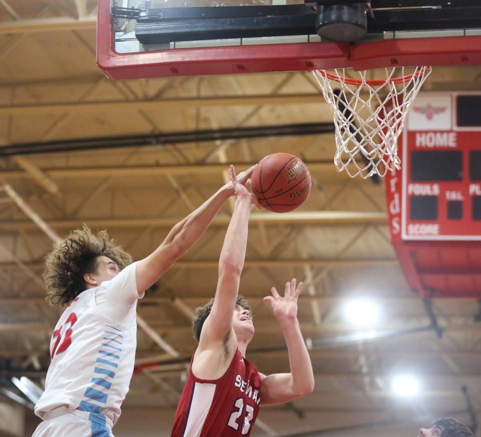 Shawnee Heights’ Jaret Sanchez secures a block against Seaman on Tuesday, Feb. 20. The Thunderbirds defeated the Vikings 69-55.