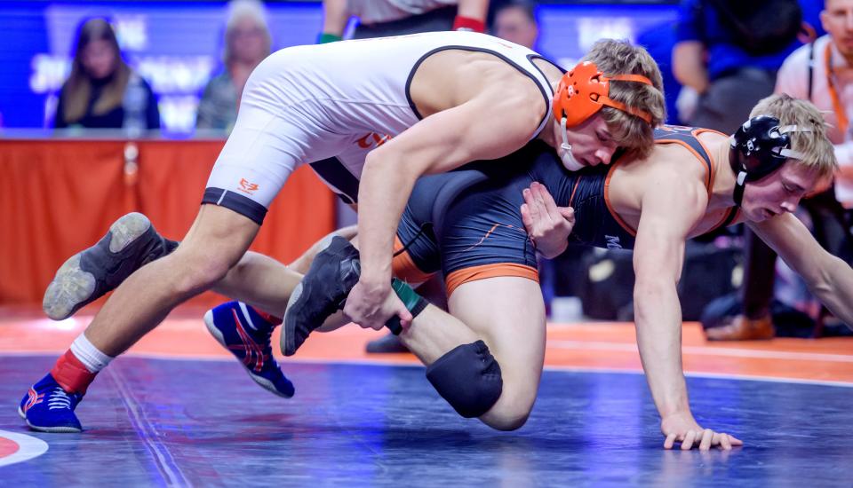 Washington's Wyatt Medlin wrestles Mt. Vernon's Dillon White in the 138-pound title match of the Class 2A state wrestling championships Saturday, Feb. 17, 2024 at the State Farm Center in Champaign. Medlin took a 10-3 decision over White.