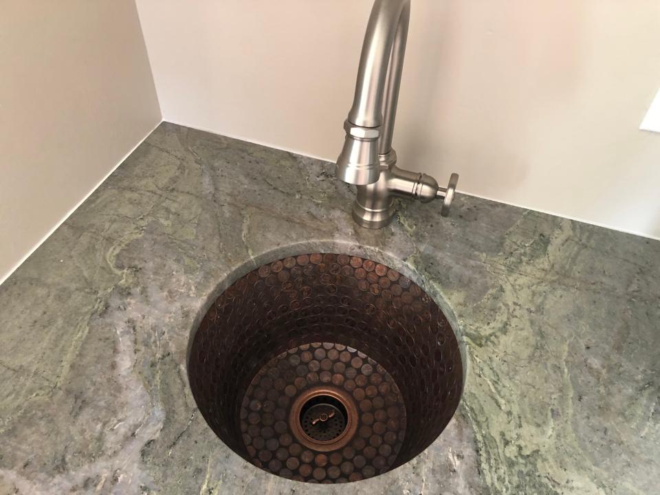 This is the special penny sink. When Audrey Fitzgerald was undergoing treatment for cancer in Philadelphia she and her husband kept finding pennies. They eventually made necklaces from the pennies. The pennies were something the Fitzgerald’s rallied around during tough times. So the sink is a special tribute to Audrey.