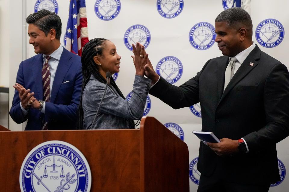 City Manager Sheryl Long high fives new Cincinnati Fire Chief Frank McKinley as they wrap up a press conference announcing his hiring at City Hall last September.