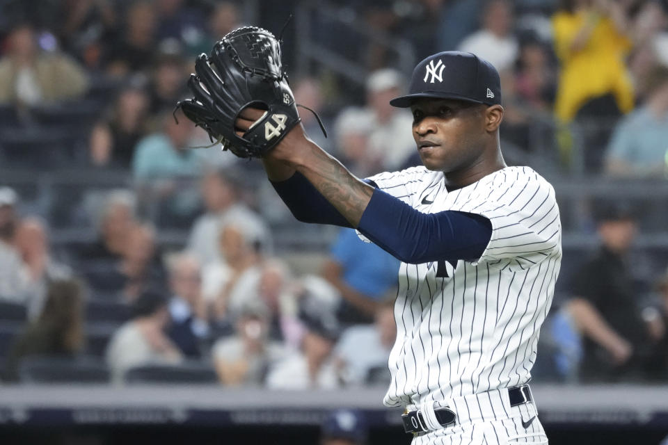 New York Yankees pitcher Domingo German gestures o fans as he leaves the field after being removed during the sixth inning of the team's baseball game against the Tampa Bay Rays, Thursday, May 11, 2023, in New York. (AP Photo/Mary Altaffer)