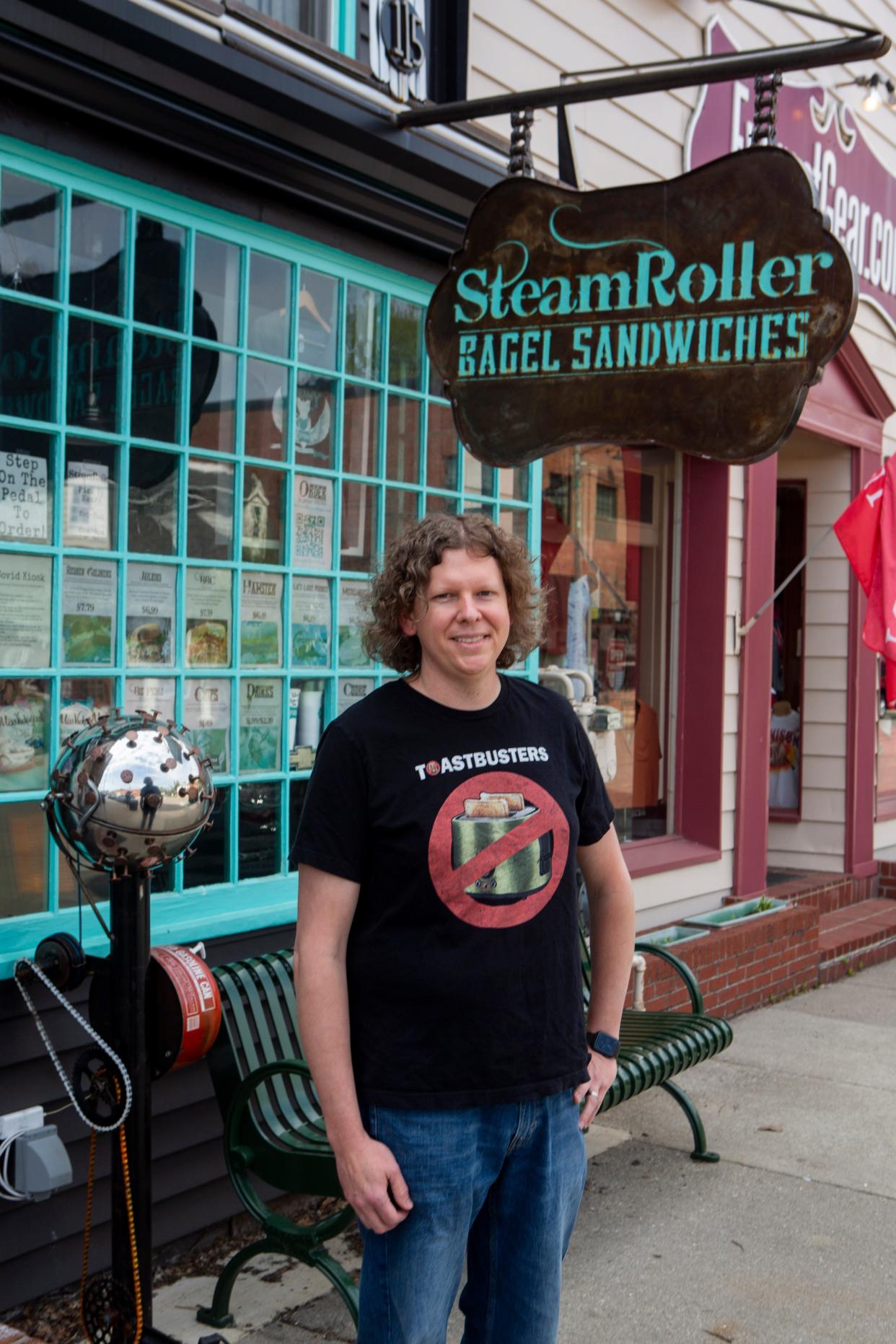 Jay Snyder, owner of SteamRoller Bagel Sandwiches, stands out in front of the SteamRoller Bagel Sandwich Shop in downtown Granville, Ohio on April 20, 2021. Snyder recently announced he plans to close the business in December.