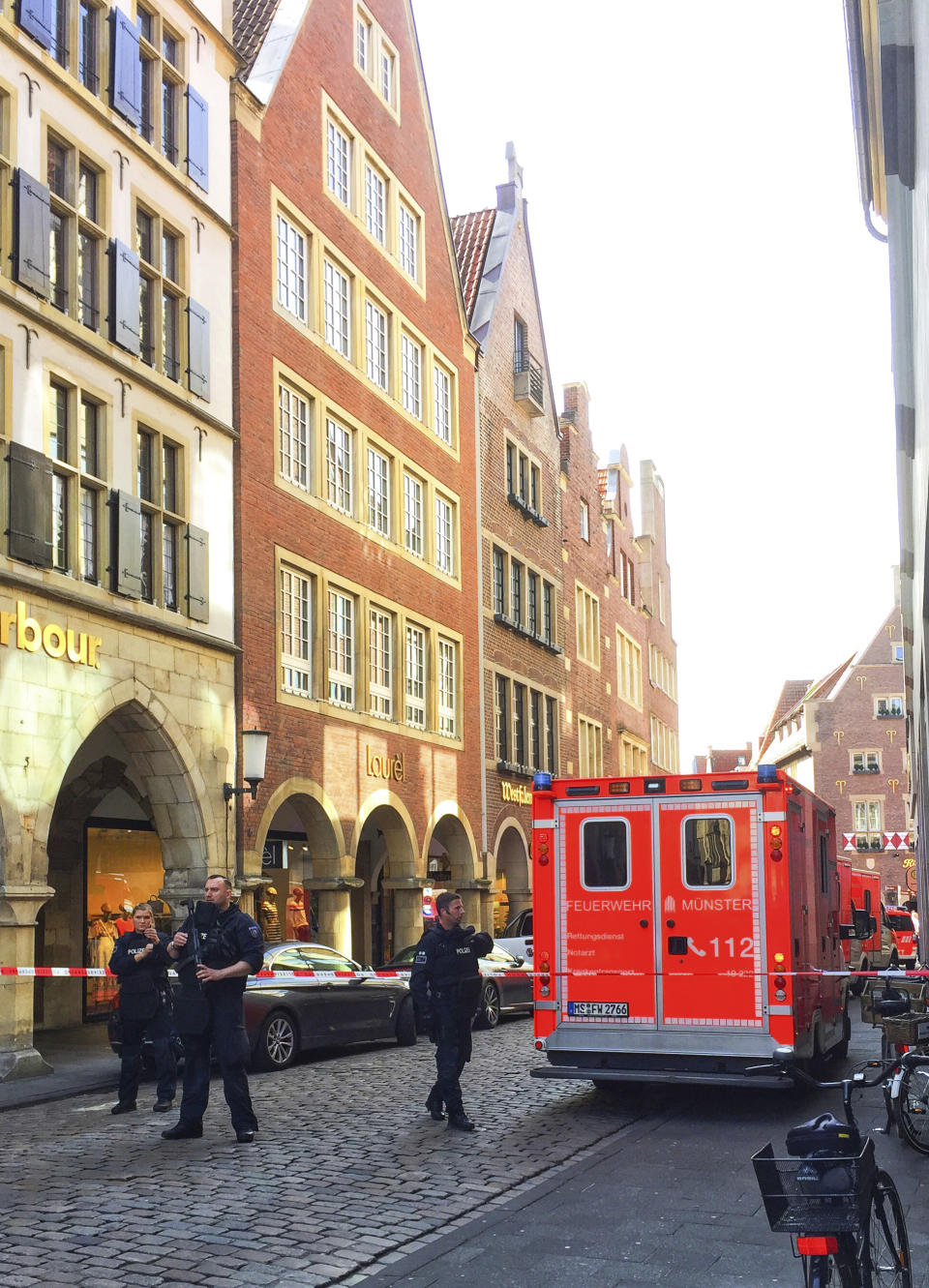 <p>Firefighters stand in downtown Muenster, Germany, Saturday, April 7, 2018. (Photo: dpa via AP) </p>