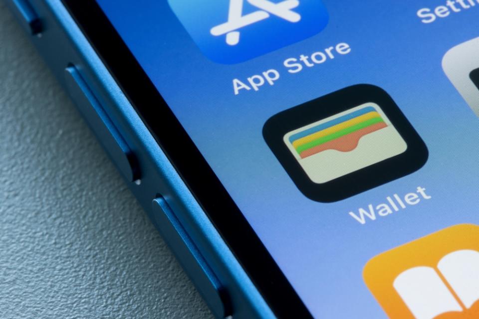 Image of an iPhone with the Apple Wallet app in focus