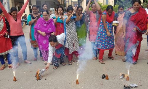 Indian women burn crackers